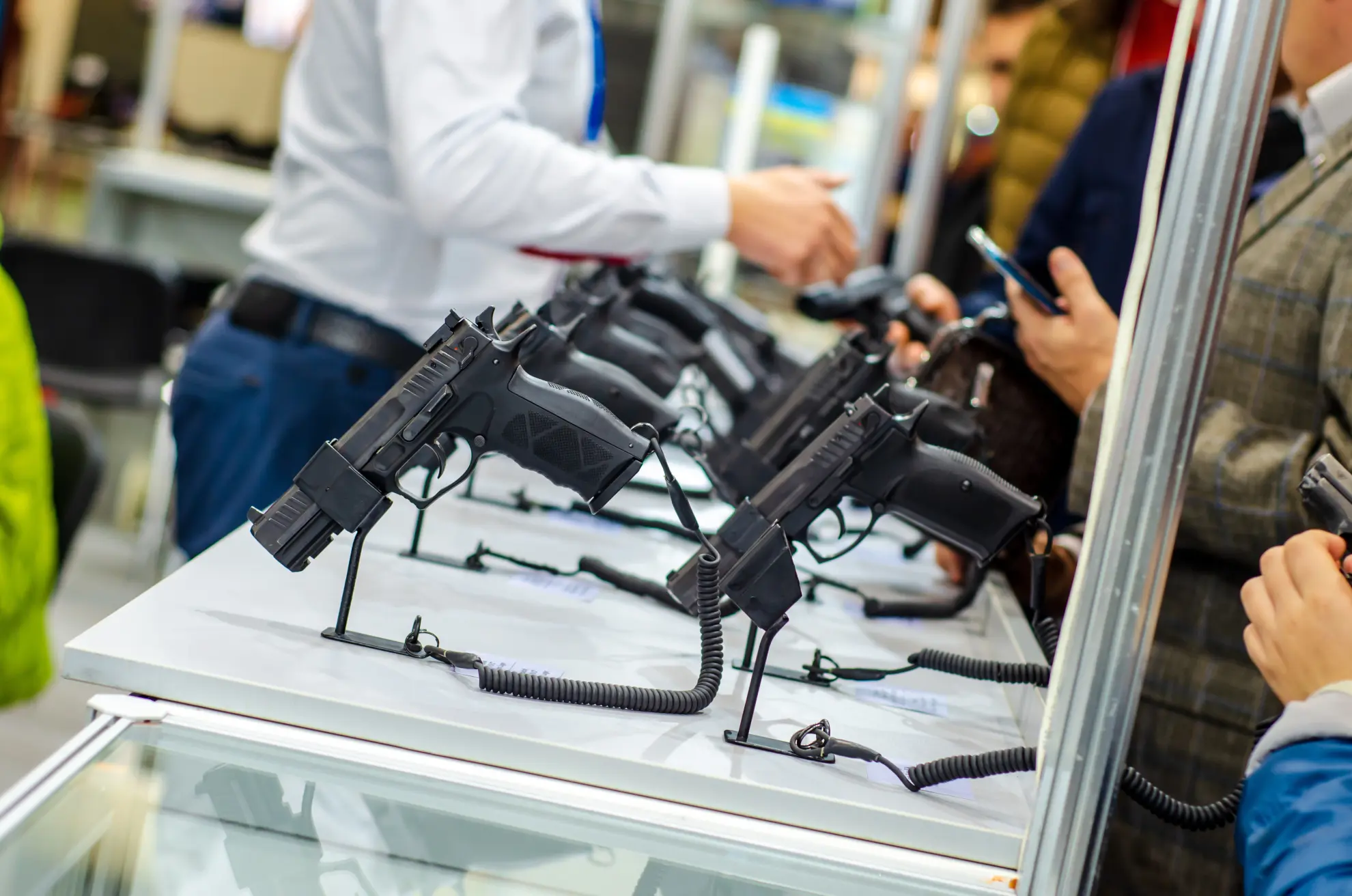 Airsoft rifles displayed on a wall